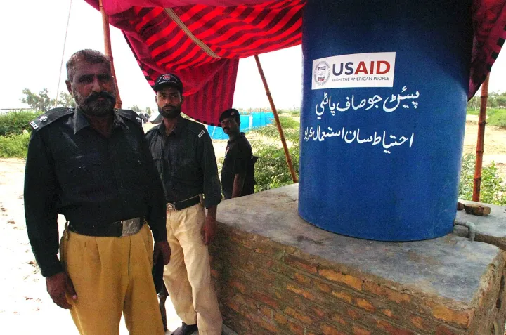Pakistani security officers guard a settlement for internally displaced persons Aug. 25, 2010, in Pakistan 100825-A-KI401-027