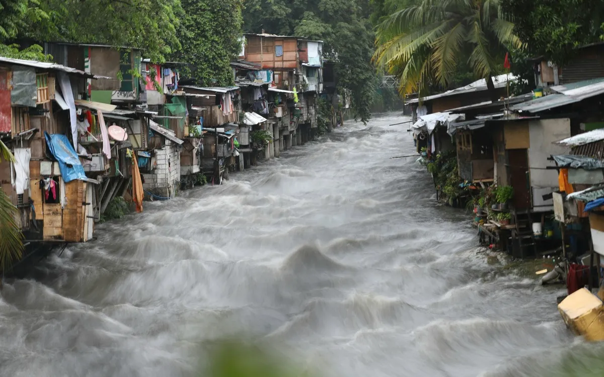 Floodwater rising along Lagarian Creek in Quezon City during southwest monsoon rains in July 2021