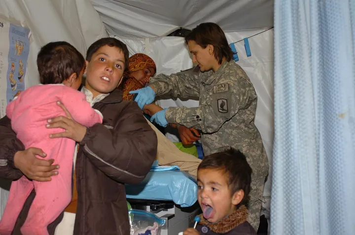 Kids wait out mom's phlebotomy, in Afghanistan