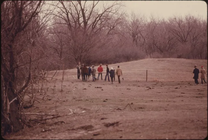 MEMBERS OF THE NATIONAL AUDUBON SOCIETY WALK ACROSS A PORTION OF THE LILLIAN ANNETTE ROWE BIRD SANCTUARY AT GRAND... - NARA - 557207