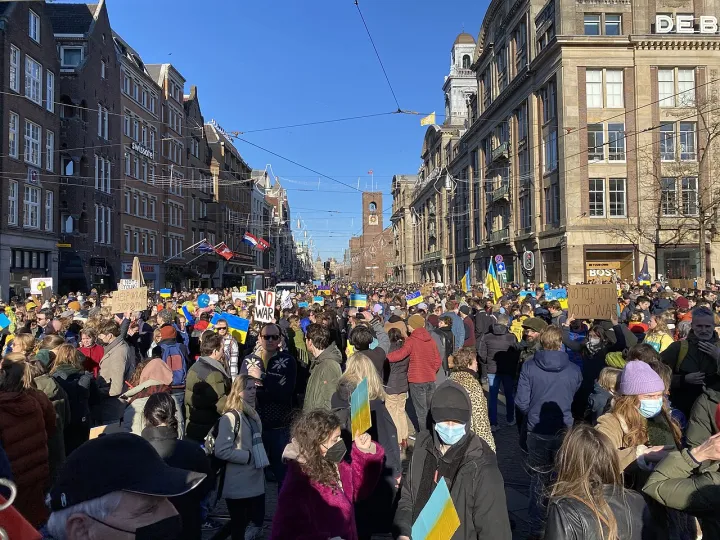 Protestors gather on Damrak in Amsterdam
