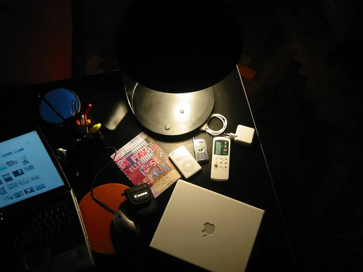Gadgets on a table with lamp 12-2004