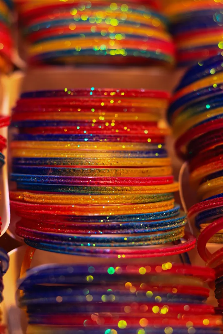 Gold bangles with intricate patterns in a jewelry display Bangladesh 03