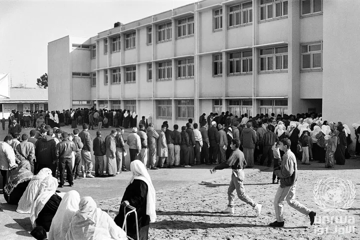Palestinians wait in line to cast their vote at the first Palestinian general election in Gaza in January 1996. The election was held under international superv