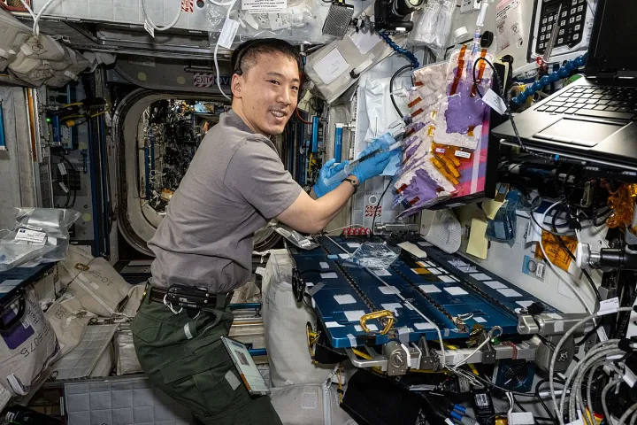 Iss073e0817658 (Oct 1, 2025) --- NASA astronaut and Expedition 73 Flight Engineer Jonny Kim works at the maintenance work area inside the International Space St