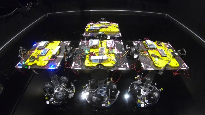 Autonomous Docking of Four Spacecraft Simulators with Applications to In-Orbit Construction