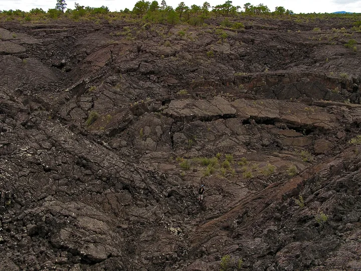 Inflation mounds form when molten lava pushes its way up through the hardening and brittle crust as it cools above. The process (1788aa61-1321-4ebb-99ec-1913345
