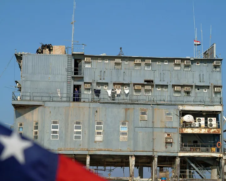 US Navy 050127-N-0401E-001 Iraqi private security officers and Sailors assigned to Mobile Security Force Detachment Two Two (MSD-22), stand watch aboard the Al 