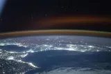 A red yellow airglow blankets Earth's horizon above southwestern Europe and North Africa, NASA
