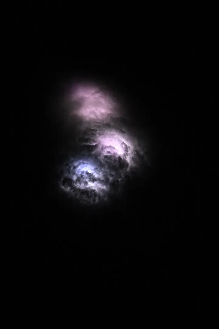 Lightning strikes illuminate the stormy cloud tops, NASA