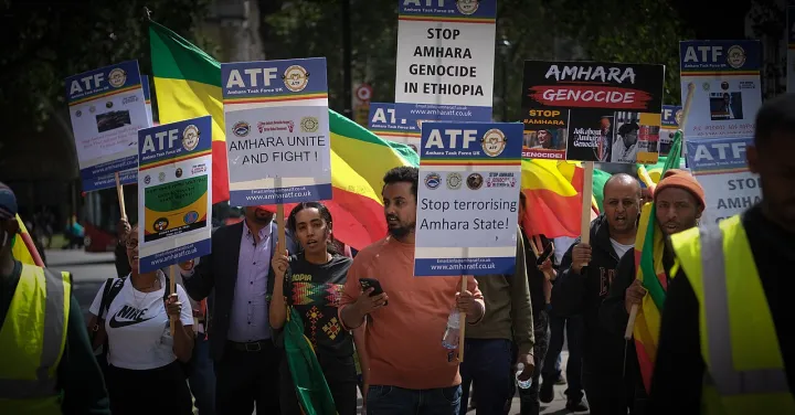 Amhara activists march across London's Parliament Square protesting against anti-Amhara violence in Ethiopia