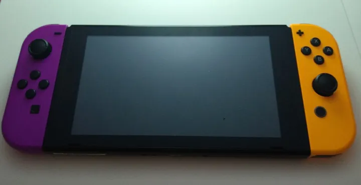 Nintendo Switch with purple and orange Joy-Cons